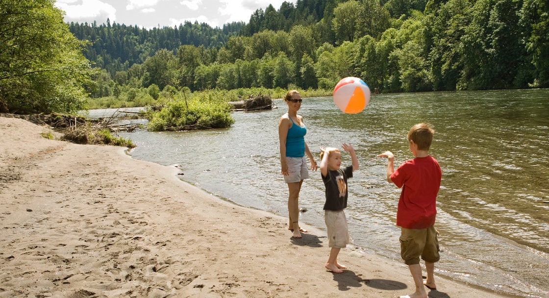 Children playing by the river at Oxbow Park