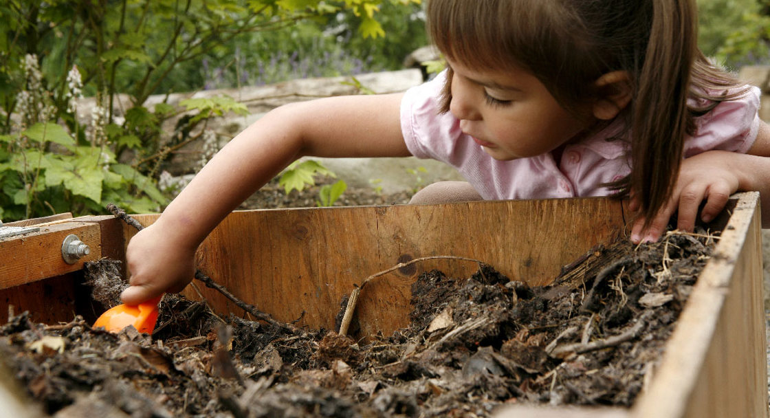 Girl playing in the discovery garden at Blue Lake Park